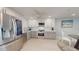 Modern kitchen featuring stainless steel appliances and bright white cabinets at 7910 Sun Island S Dr # 305, South Pasadena, FL 33707