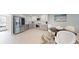 Modern kitchen featuring stainless steel appliances and bright white cabinets at 7910 Sun Island S Dr # 305, South Pasadena, FL 33707