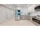 Updated kitchen with stainless steel appliances and a modern subway tile backsplash at 7910 Sun Island S Dr # 305, South Pasadena, FL 33707