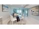 Modern dining area seamlessly flows into the living room, offering a comfortable and stylish living space at 7910 Sun Island S Dr # 305, South Pasadena, FL 33707