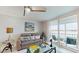 Charming living room with a cozy sofa, elegant decorations, and a delightful balcony at 7910 Sun Island S Dr # 305, South Pasadena, FL 33707