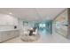 Open-concept living area with a dining space, kitchen, and comfortable seating arrangement at 7910 Sun Island S Dr # 305, South Pasadena, FL 33707