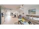 Bright open-plan living area featuring white floors, comfortable seating, and modern decor at 7910 Sun Island S Dr # 305, South Pasadena, FL 33707