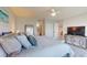 Serene main bedroom with a plush bed, closet space, and access to an ensuite bathroom at 7910 Sun Island S Dr # 305, South Pasadena, FL 33707