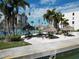 Lakeside picnic area with charming tiki huts, offering a relaxing atmosphere for outdoor gatherings and community events at 7910 Sun Island S Dr # 305, South Pasadena, FL 33707