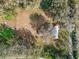 Bird's-eye view showcasing the property layout with spacious yard, trees, and surrounding area at 8408 Bob Wiggs Ave, Lithia, FL 33547