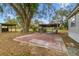 Spacious backyard area with concrete patio and covered carport, great for outdoor entertaining at 8408 Bob Wiggs Ave, Lithia, FL 33547