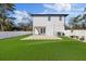 Exterior back of home features a spacious backyard and privacy fence at 902 W Sligh Ave, Tampa, FL 33604
