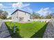 Exterior back of home features a large backyard at 902 W Sligh Ave, Tampa, FL 33604
