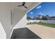 A backyard features a covered patio and artificial grass at 902 W Sligh Ave, Tampa, FL 33604