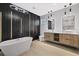 Luxurious bathroom with a free-standing tub, walk-in shower, and modern vanity at 902 W Sligh Ave, Tampa, FL 33604