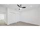 Empty bedroom featuring wood-look floors, double closets and modern window shades at 902 W Sligh Ave, Tampa, FL 33604