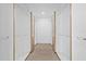 Walk-in closet featuring custom built-in storage and a vinyl plank floor at 902 W Sligh Ave, Tampa, FL 33604