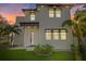 Contemporary two-story home showcasing a minimalist design and modern architectural details at 902 W Sligh Ave, Tampa, FL 33604