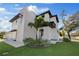 Modern home with black trim, white walls, and a well-manicured front yard at 902 W Sligh Ave, Tampa, FL 33604