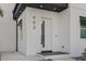 Close up of modern front door and a visible house number at 902 W Sligh Ave, Tampa, FL 33604
