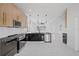 Spacious kitchen with an island, marble floors, and stainless steel appliances at 902 W Sligh Ave, Tampa, FL 33604