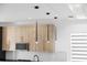 Modern kitchen features sleek pendant lighting over the counter at 902 W Sligh Ave, Tampa, FL 33604