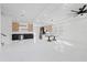 Spacious open-concept living area with modern fixtures and marble floors offers ample natural light at 902 W Sligh Ave, Tampa, FL 33604