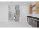 Bright living area with wine storage, staircase, wine cooler, and marble flooring at 902 W Sligh Ave, Tampa, FL 33604