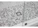 A modern shower floor features stone tiles at 902 W Sligh Ave, Tampa, FL 33604