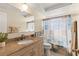 Bathroom featuring a granite vanity top, a large mirror, and coordinated decor at 10735 Manchester Rd, Port Richey, FL 34668