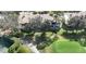 Aerial view of homes surrounded by lush landscaping and a manicured golf course at 1290 Clays Trl, Oldsmar, FL 34677