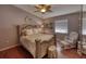 Comfortable bedroom with hardwood floors, a ceiling fan, and neutral walls at 1290 Clays Trl, Oldsmar, FL 34677