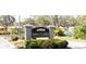 Elegant entrance sign to Laurel Oaks community with manicured landscaping at 1290 Clays Trl, Oldsmar, FL 34677