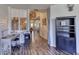 Hallway with wood floors leading to staircase at 1290 Clays Trl, Oldsmar, FL 34677