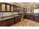 Stylish kitchen featuring stainless steel appliances, tile backsplash, and ample cabinet space at 1290 Clays Trl, Oldsmar, FL 34677