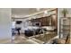 Kitchen showcasing granite countertops, stainless steel appliances, and dark wood cabinetry at 1290 Clays Trl, Oldsmar, FL 34677