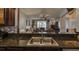 Open-concept view from the kitchen, showcasing granite countertops and seamless flow to the living area at 1290 Clays Trl, Oldsmar, FL 34677