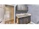 Laundry room with ample storage space, including cabinets and a sink with tiled backsplash at 1290 Clays Trl, Oldsmar, FL 34677