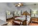 Main bedroom with king size bed and sliding closet mirror at 1290 Clays Trl, Oldsmar, FL 34677