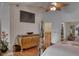 Bright main bedroom with ceiling fan and decorative dresser at 1290 Clays Trl, Oldsmar, FL 34677