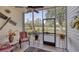 Relaxing screened patio with comfortable seating and views of the lush backyard and landscape at 1290 Clays Trl, Oldsmar, FL 34677