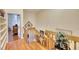 Wooden staircase with railing, open to the foyer below at 1290 Clays Trl, Oldsmar, FL 34677