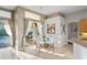 Charming dining area with natural light and views of the outdoor patio and pool at 1405 Kensington Woods Dr, Lutz, FL 33549