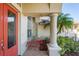 Charming front porch featuring stylish decor, a decorative bike, and a welcoming entrance at 1405 Kensington Woods Dr, Lutz, FL 33549