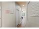 Hallway leading to a bedroom with a trey ceiling, adding architectural interest to the home at 1405 Kensington Woods Dr, Lutz, FL 33549