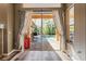 Sliding door leading to a covered patio and sparkling pool area, inviting outdoor living at 1405 Kensington Woods Dr, Lutz, FL 33549