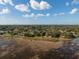 Beautiful aerial view of the property, showcasing the tranquil lake at 1472 Ivydale Rd, Spring Hill, FL 34606