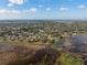 Aerial view showcasing the location of the home near a waterfront, with vast skies above at 1472 Ivydale Rd, Spring Hill, FL 34606