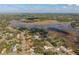 Aerial shot of a neighborhood next to lake at 1472 Ivydale Rd, Spring Hill, FL 34606