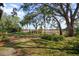 Lush backyard oasis, with mature trees offering plenty of shade at 1472 Ivydale Rd, Spring Hill, FL 34606