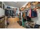 Organized walk-in closet with shelves, hanging rods, and ample storage space at 1472 Ivydale Rd, Spring Hill, FL 34606