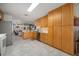 Spacious kitchen with wooden cabinets, white countertops and a large stainless steel refrigerator at 1472 Ivydale Rd, Spring Hill, FL 34606
