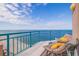 Condo balcony with comfortable seating featuring views of the beach and ocean at 1520 Gulf Blvd # Ph1 1901, Clearwater Beach, FL 33767