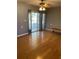 Bedroom featuring hardwood floors, a sliding glass door, and a ceiling fan at 1811 Ridge S Rd, Largo, FL 33778